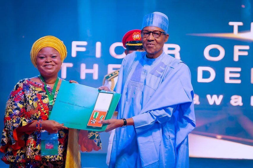 Princess Adejoke Orelope-Adefulire receiving the Officer of the Order of the Federal Republic honour from President Muhammadu Buhari